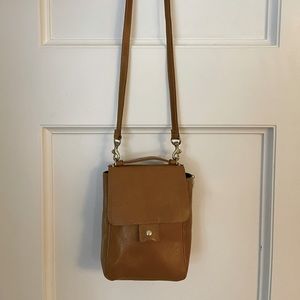 Clare V mustard colored camera bag